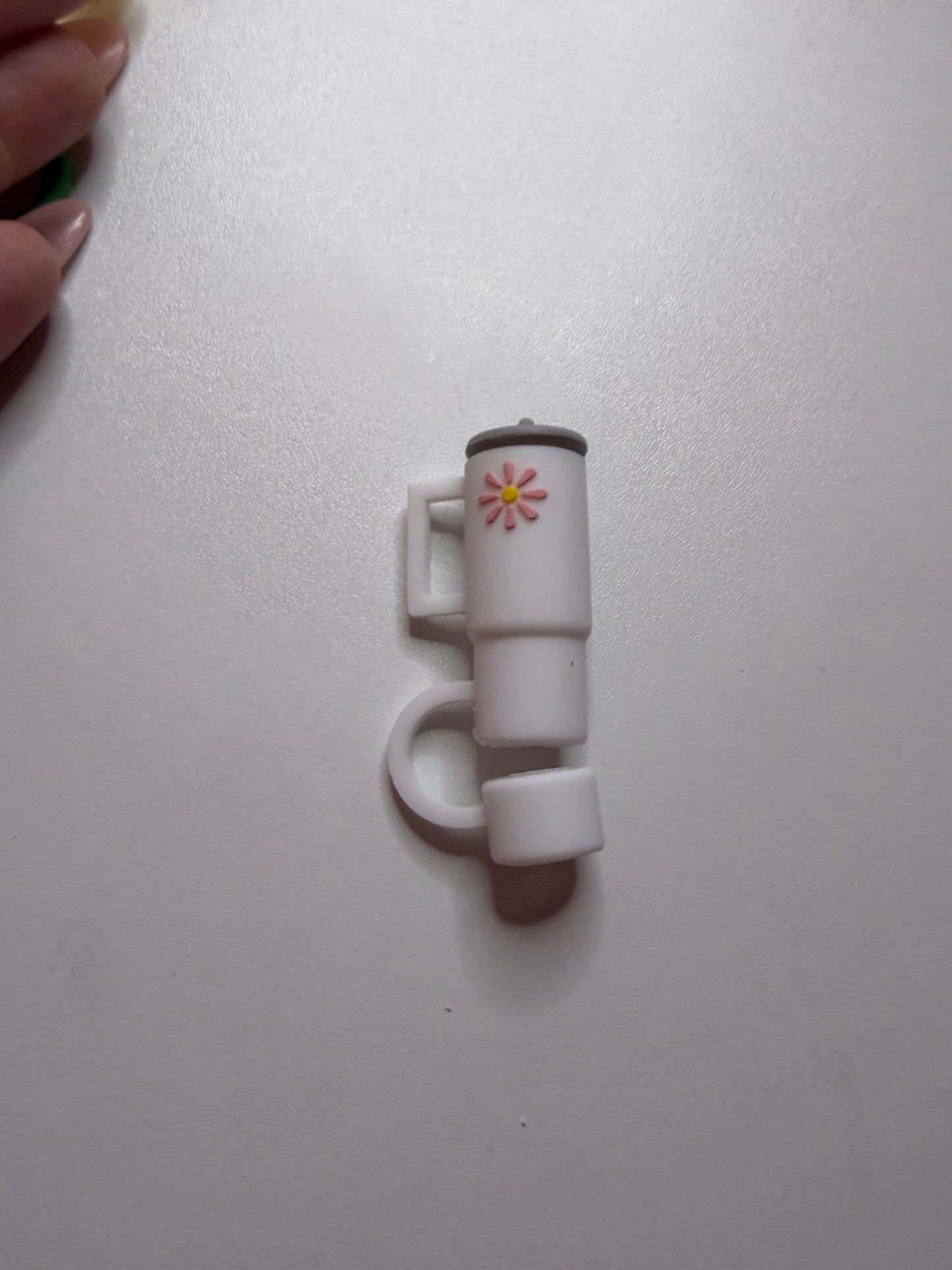 White tumbler with flower