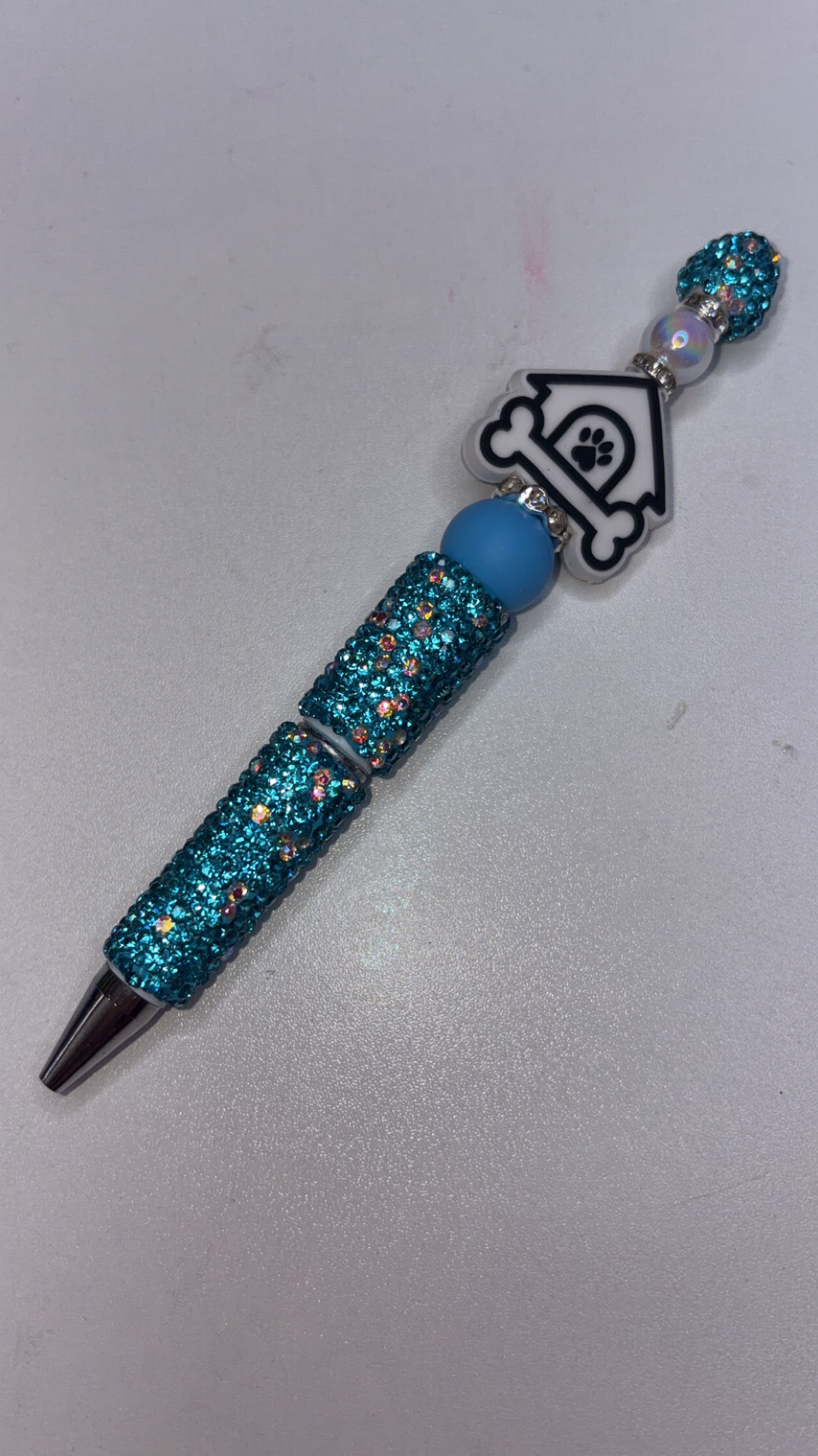 Light blue bling, pen, doghouse