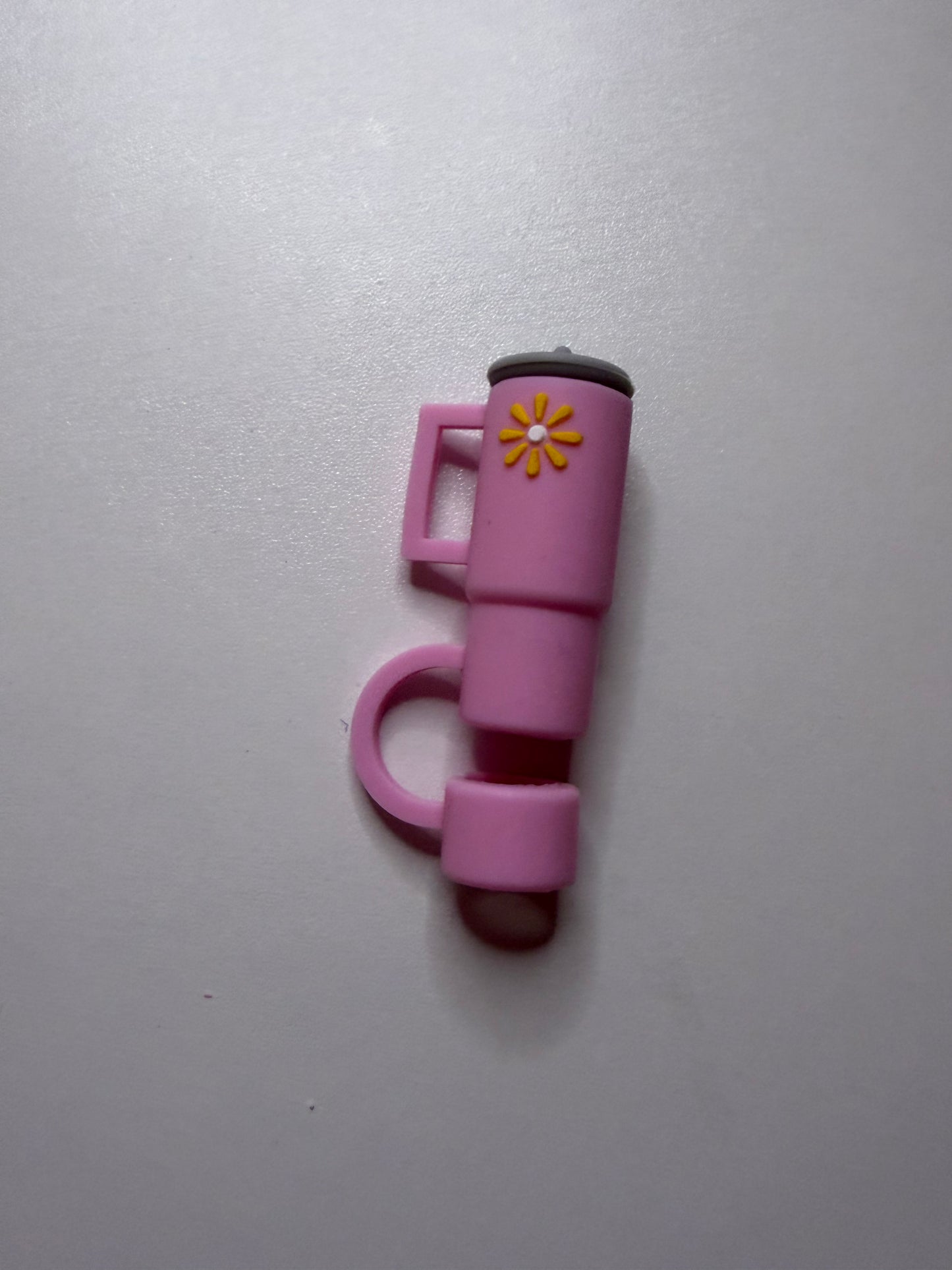 Pink tumbler with flower