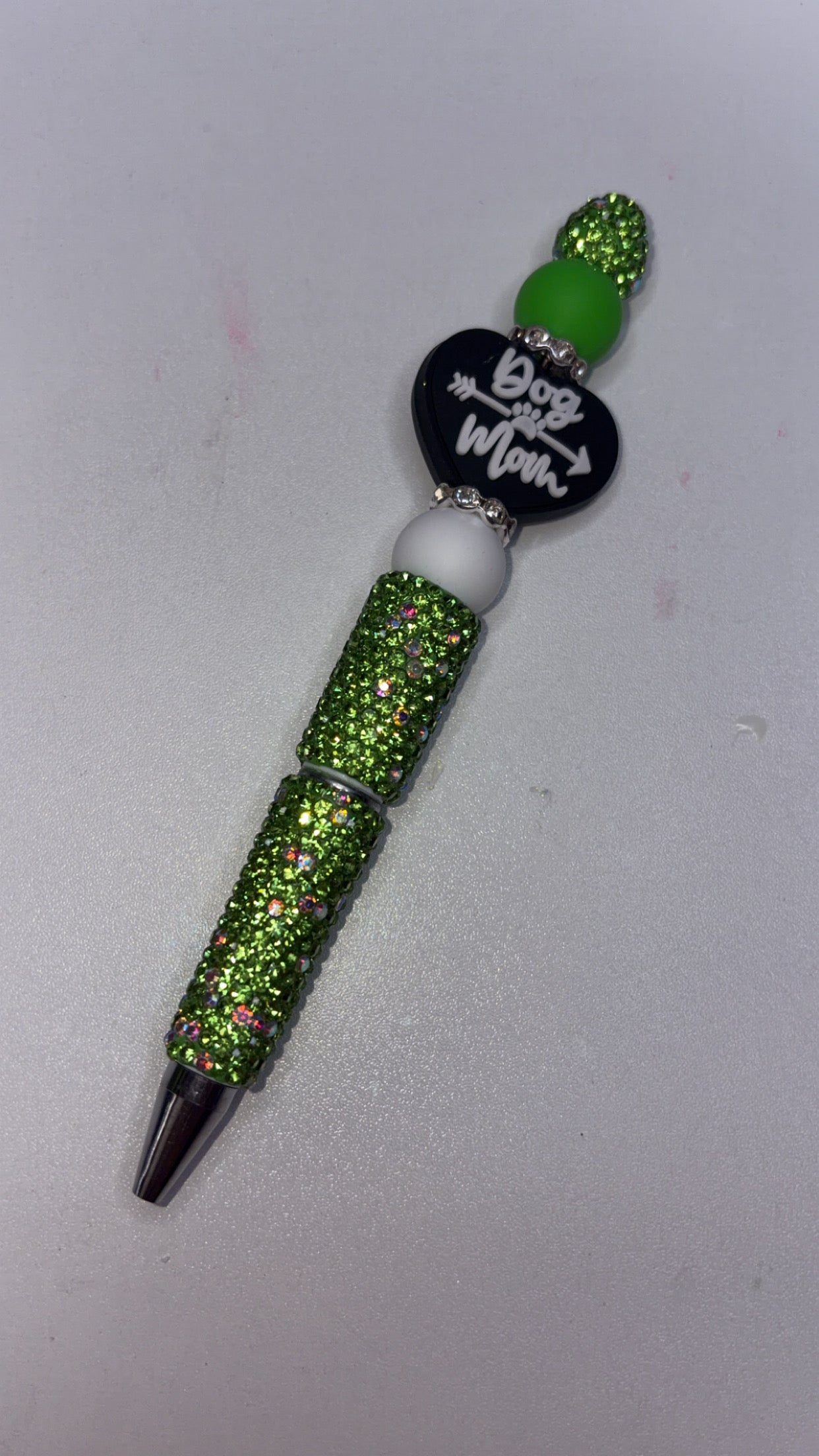 Green bling, pen, dog, Mom ￼